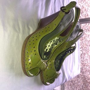 Spring has sprung in these patent leather green peep-toe sling back wedgies.